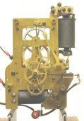 Self-Winding clock center wheel and mainspring front view