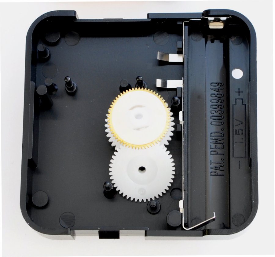Korean quartz clock movement removing the parts to show the electrical contacts